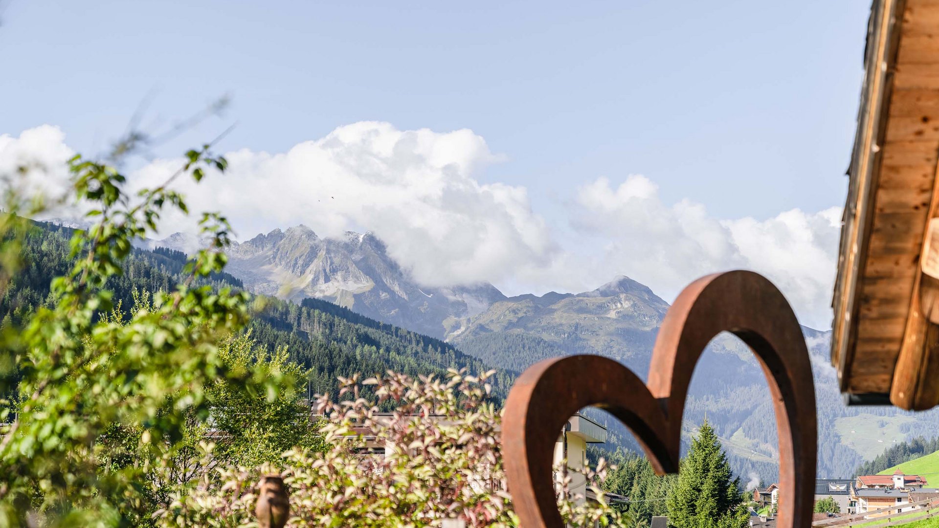 Your hosts in Gerlos • Der Grubacher: Eco Hotel in Gerlos View from the garden of the mountain landscape