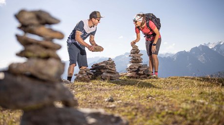 Pictures & Impressions • Der Grubacher: Hotel in Gerlos A couple builds a cairn in the mountains